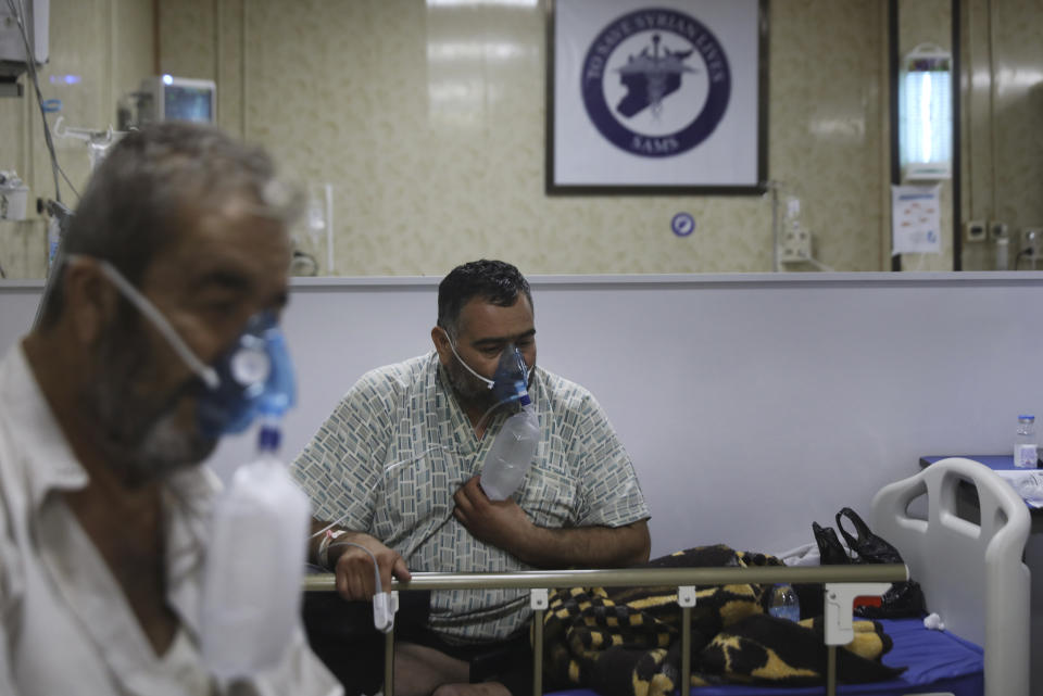 Patients infected with the coronavirus breathe with respirators, in the intensive care unit at the Syrian American Medical Society Hospital, in the city of Idlib, northwest Syria, Monday, Sept. 20, 2021. Coronavirus cases are surging to the worst levels of the pandemic in Idlib province, a rebel stronghold in Syria — a particularly devastating development in a region where scores of hospitals have been bombed and that doctors and nurses have fled in droves during a decade of war. (AP Photo/Ghaith Alsayed)