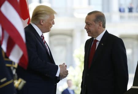 FILE PHOTO: U.S President Donald Trump (L) talks with Turkey's President Recep Tayyip Erdogan as he arrives at the entrance to the West Wing of the White House in Washington, U.S. May 16, 2017. REUTERS/Joshua Roberts