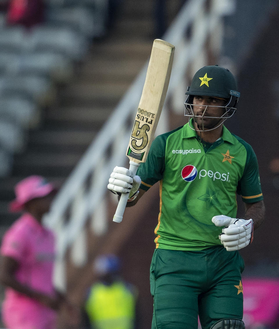 Pakistan's batsman Fakhar Zaman raises his bat to celebrate scoring a century during the second One Day International cricket match between South Africa and Pakistan at the Wanderers stadium in Johannesburg, South Africa, Sunday, April 4, 2021. (AP Photo/Themba Hadebe)