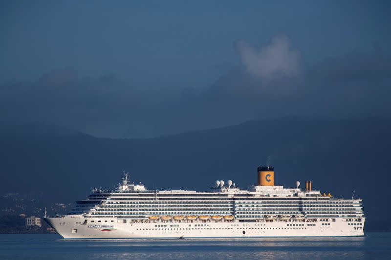 The Costa Luminosa cruise ship prepares to moor at the port of the island of Corfu