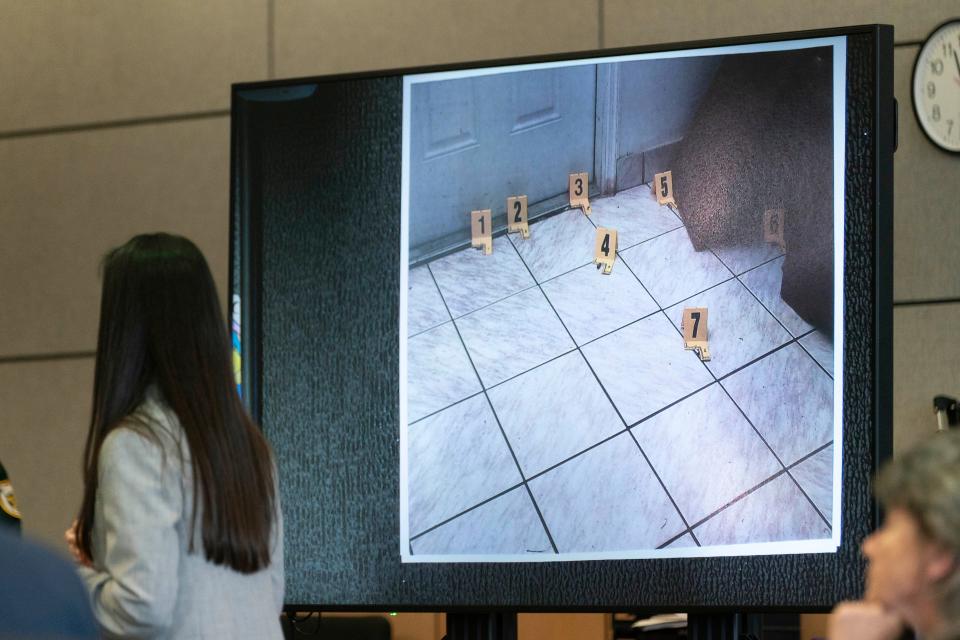 Assistant State attorney Marci Rex shows photos of the crime scene during the sentencing of Jonathan Schuler Palm Beach County Courthouse in West Palm Beach, Florida on May 4, 2021.