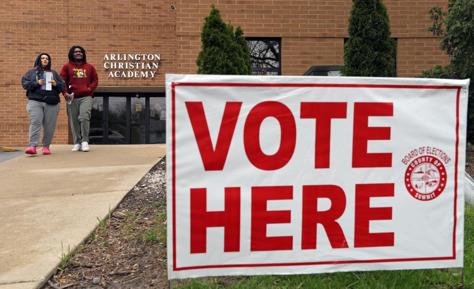 Shyleen Connalley, left, and Devon Woods, both 25, leave Arlington Church of God on election day Tuesday in Akron. The pair had gone to the church to cast their vote for Tara Mosley, but were turned away because they went to the wrong polling location.