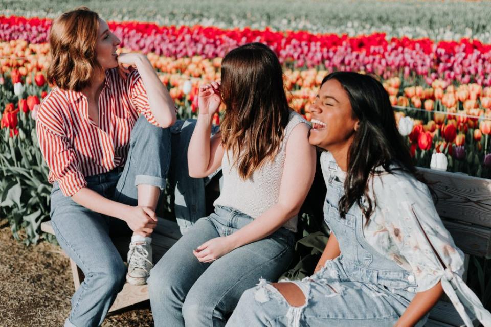 Expedia is consolidating its loyalty programs. Pictured are travelers relaxing in a garden. Source: Unsplash/Priscilla Du Preez Priscilla Du Preez / Unsplash