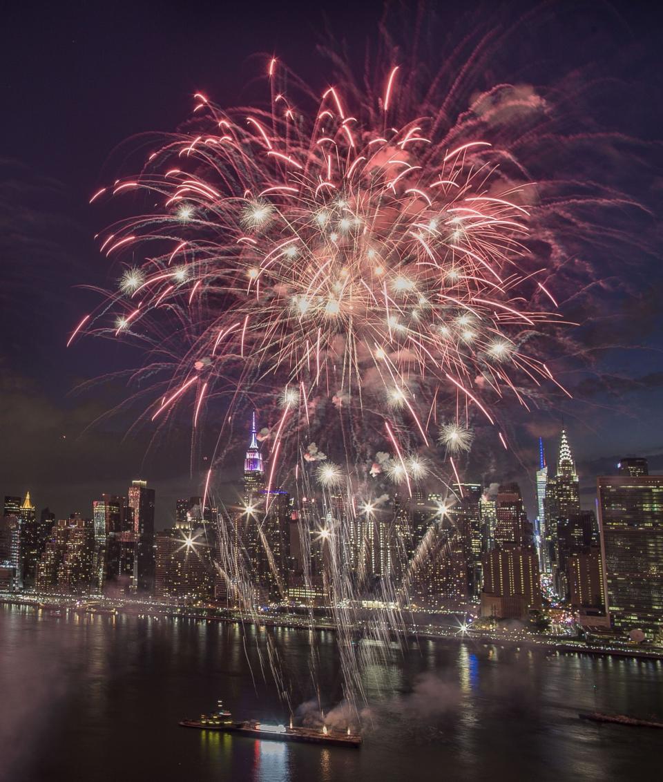 <p>Fireworks explode over New York City on Independence Day (Rex Features) </p>