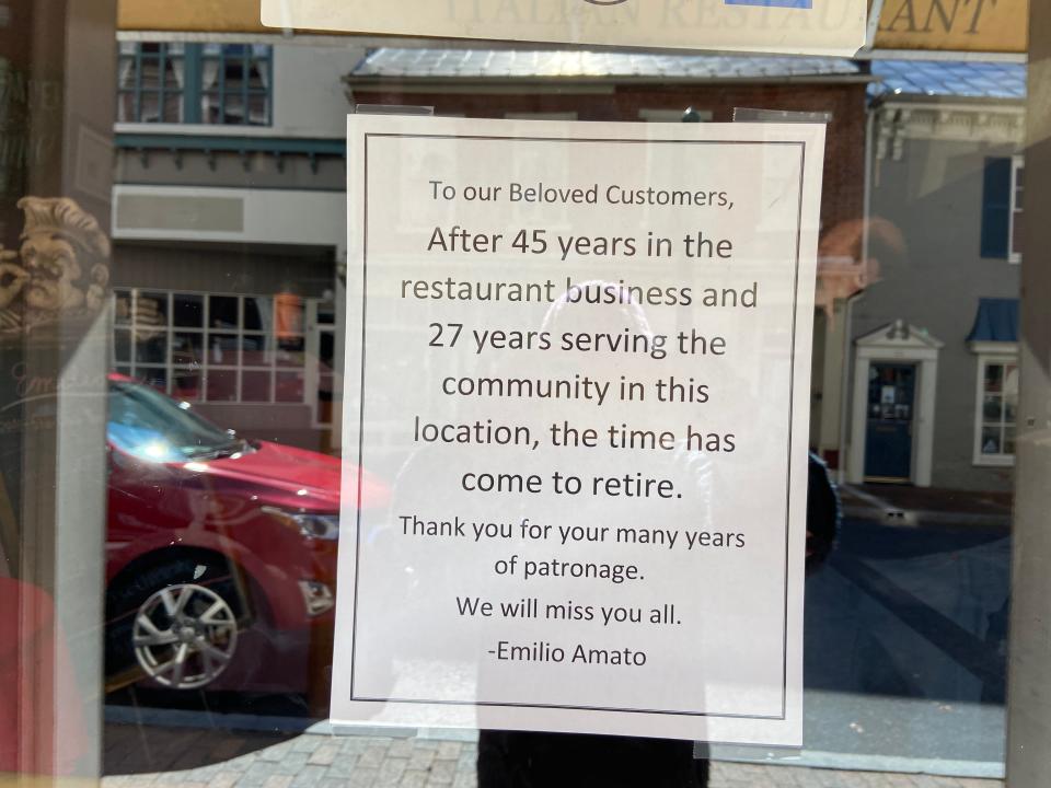 A sign hangs in the window of Emilio's in downtown Staunton informing customers of its closure.