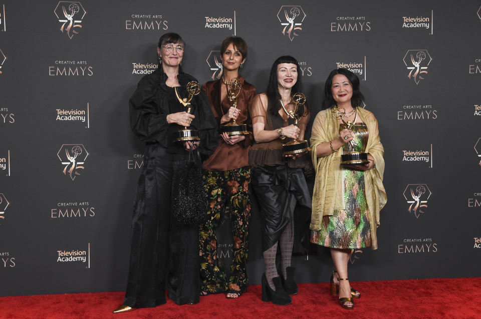 Sharon Long, from left, Claire Tremlett, Basia Kuznar, and Anna Lau, pose with the award for outstanding period costumes for a series for "The Great" in the press room during night one of the Creative Arts Emmy Awards on Saturday, Jan. 6, 2024, at the Peacock Theater in Los Angeles. (Photo by Richard Shotwell/Invision/AP)