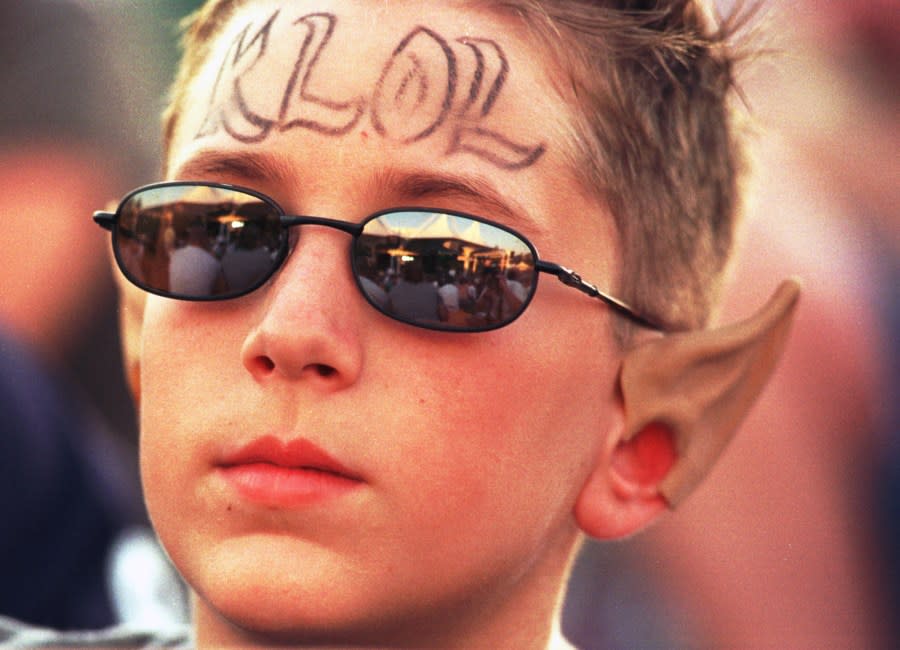 Cody Dyce, 12, of Huffman, dons a KLOL logo and pointed ears as he watches Smashmouth during the KLOL Fall Jamm 5 at the Cynthia Woods Mitchell Pavilion Saturday, Oct. 2, 1999, in The Woodlands, Texas. i(Photo by Brett Coomer/Special to The Chronicle) KLOL’s FALL JAMM V (Photo by Brett Coomer/Houston Chronicle)
