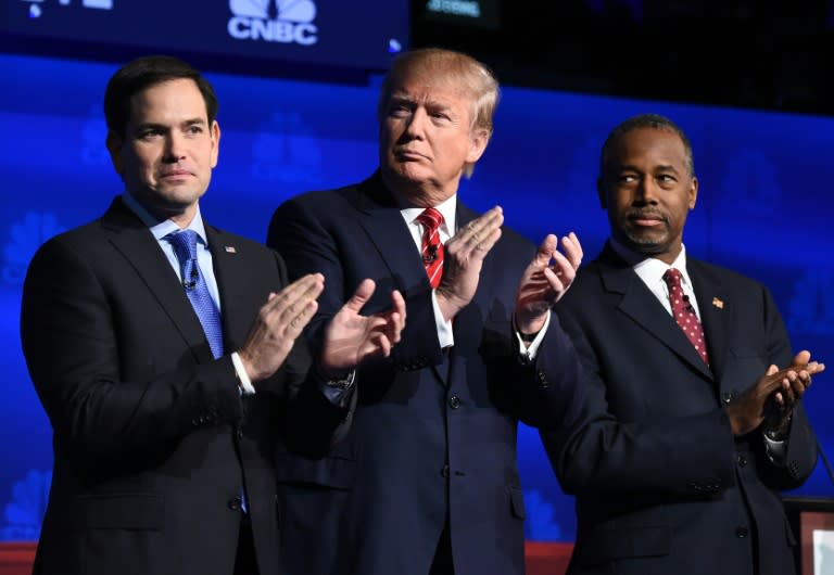 Republican presidential hopefuls Marco Rubio (L) and Ben Carson (R), pictured October 28, 2015 at a debate with rival Donald Trump, were among targets of Trump's jabs as he filed candidacy papers in New Hampshire November 4