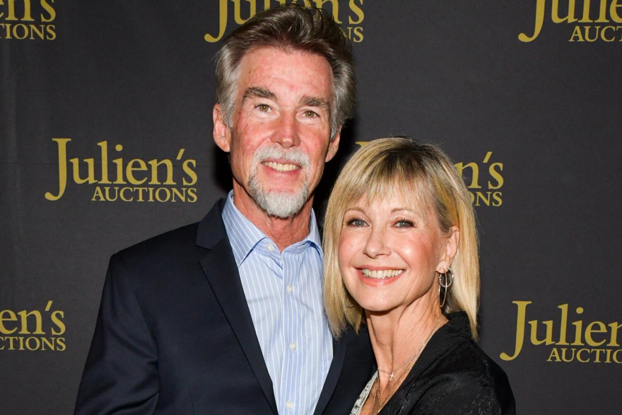 Olivia Newton-John (R) and John Easterling attend the VIP reception for upcoming "Property of Olivia Newton-John Auction Event at Julien’s Auctions on October 29, 2019 in Beverly Hills, California.