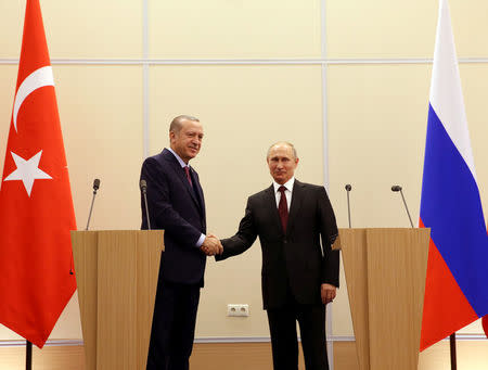 Turkish President Tayyip Erdogan and his Russian counterpart Vladimir Putin attend a news conference in Sochi, Russia, November 13, 2017. Yasin Bulbul/Presidential Palace/Handout via REUTERS