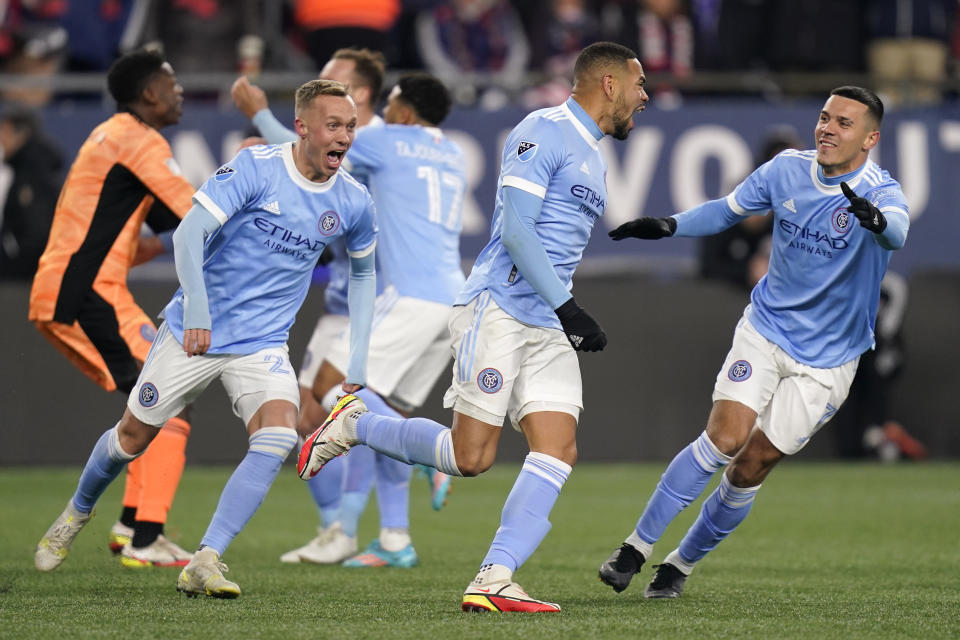 New York City FC players celebrate after defeating the New England Revolution in an MLS playoff soccer match Tuesday, Nov. 30, 2021, in Foxborough, Mass. (AP Photo/Charles Krupa)