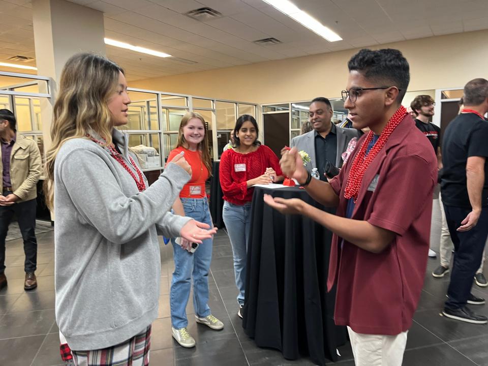 Ava Bien of St. Dominic Savio Catholic High School competes in a rock paper scissors game against Rehan Ali of Westlake High School during the opening event of Student Visionaries of the Year for the Leukemia & Lymphoma Society.