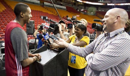 Miami Heat player Mario Chalmers (L) answers questions from reporters during practice at the American Airlines Arena in Miami, Florida. The Heat and the Oklahoma City Thunder are preparing for Game 5 of their NBA Finals scheduled for June 21
