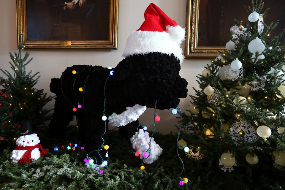 A replica of Bo, the first family's Portuguese Water Dog, is on display during a preview of the 2012 White House holiday decorations November 28, 2012 at the White House in Washington, DC. The first lady welcomed military families, including Gold Star and Blue Star parents, spouses and children, to the White House for the first viewing of the 2012 holiday decorations. The theme for the White House Christmas 2012 is "Joy to All." (Photo by Alex Wong/Getty Images)