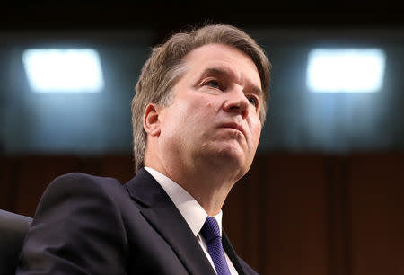 FILE PHOTO: Supreme Court nominee Brett Kavanaugh looks on during his Senate Judiciary Committee confirmation hearing September 4, 2018. REUTERS/Chris Wattie