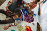Burundian refugees receive medical treatment in the fishing village of Kagunga, Tanzania on May 21, 2015