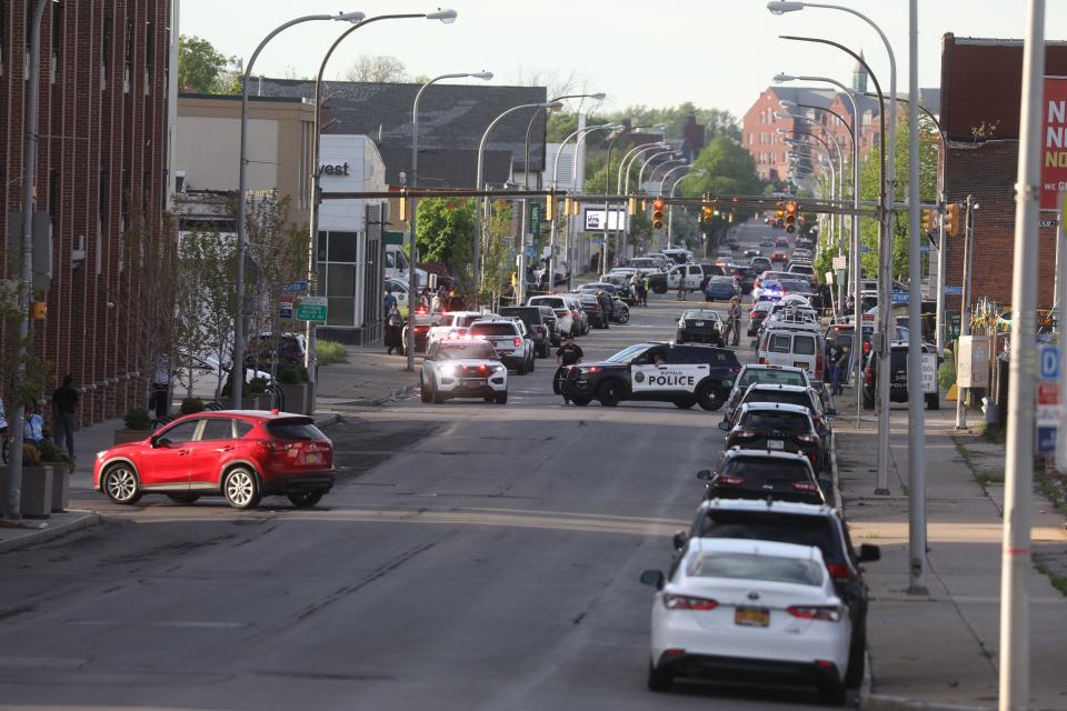 10 people were killed and three others injured in a shooting at a Buffalo, NY grocery store on May 14, 2022.  The 18-year-old from Conklin, NY allegedly shot people inside and outside of the Tops Friendly Market and was motivated by hate, authorities said.  11 of the 13 people shot were Black.  A view of Jefferson Ave. where it's blocked off by several police agencies.