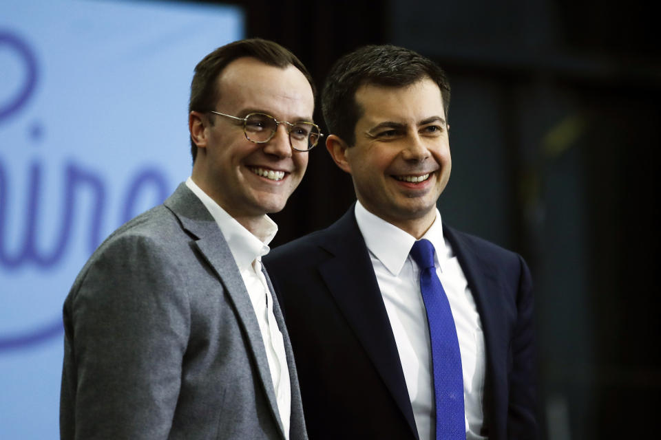 Former South Bend, Ind., Mayor Pete Buttigieg and his husband Chasten Buttigieg acknowledge the audience at the end of a campaign event on Feb. 10, 2020, in Milford, N.H. (Matt Rourke / AP file)