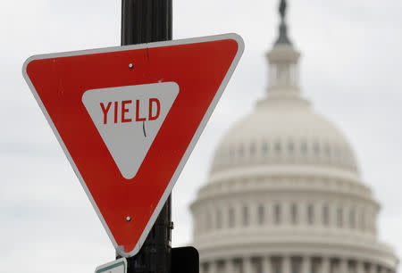 The U.S. Capitol is seen beyond a traffic sign during the partial government shutdown in Washington, U.S., January 8, 2019. REUTERS/Kevin Lamarque