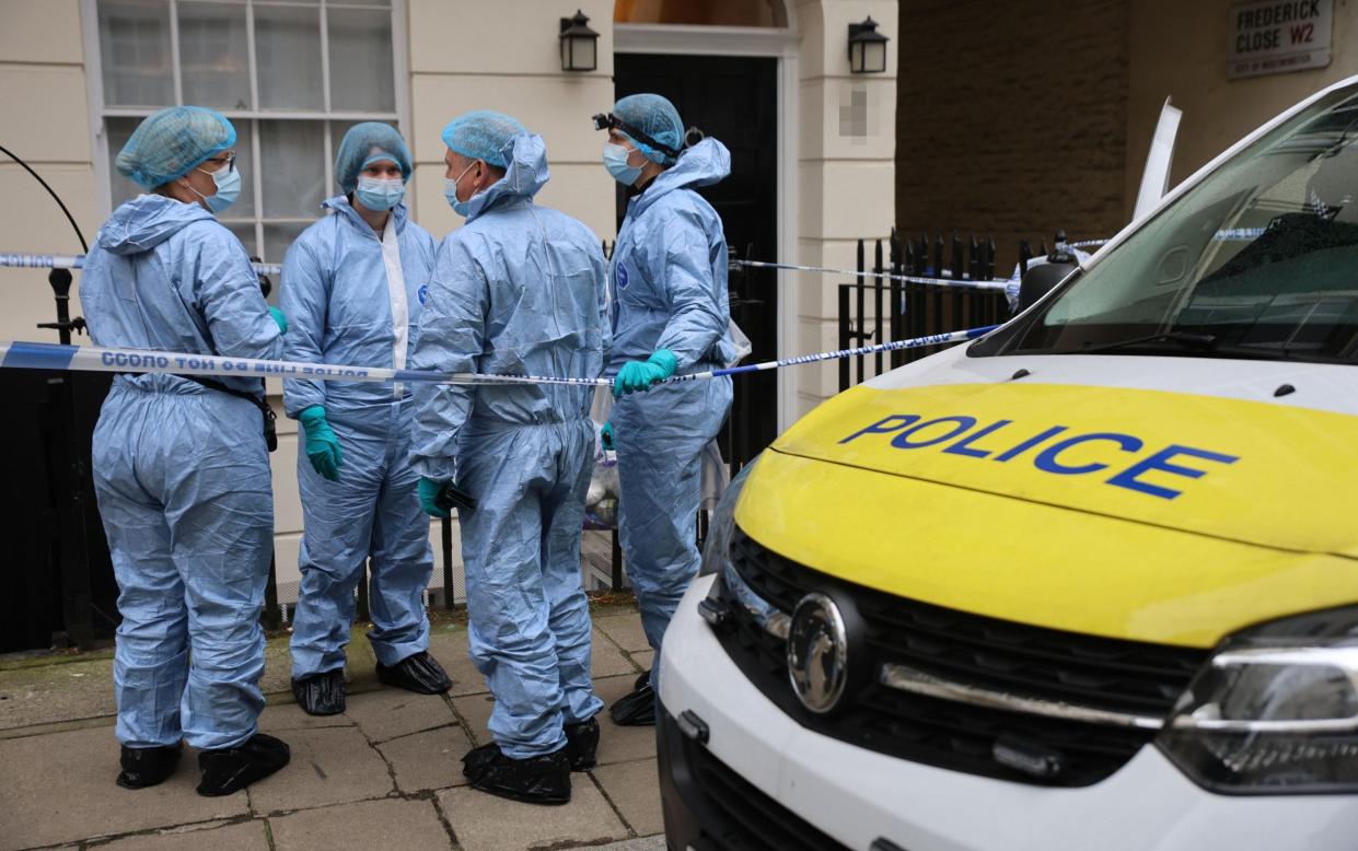 Forensic officers at the scene of a murder investigation on Stanhope Place, Bayswater