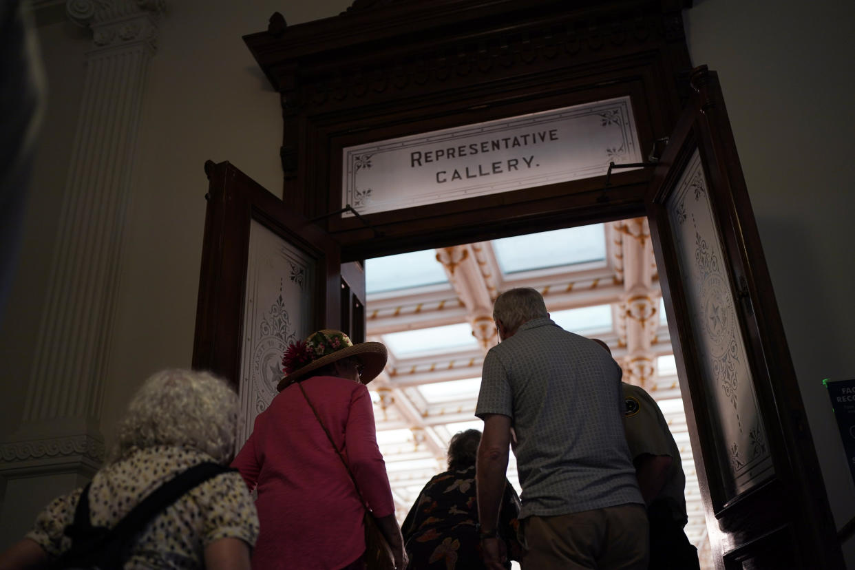 Visitors arrive for the impeachment proceedings against state Attorney General Ken Paxton at the House Chamber at the Texas Capitol in Austin, Texas, Saturday, May 27, 2023. Texas lawmakers have issued 20 articles of impeachment against Paxton, ranging from bribery to abuse of public trust as state Republicans surged toward a swift and sudden vote that could remove him from office. (AP Photo/Eric Gay)