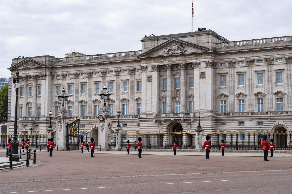 Grenadier Guards stand on duty deliniating the procession route outside Buckingham Palace at the State Funeral of Queen Elizabeth II on 19th September 2022 in London, United Kingdom. 11 days after it was announced that the Queen had passed away, hundreds of thousands of people gathered in central London to witness the funeral procession. (photo by Mike Kemp/In Pictures via Getty Images)