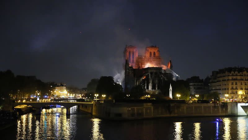 Notre Dame cathedral is seen burning in Paris, Monday, April 15, 2019. The restoration project is expected to be completed by the end of 2024. 