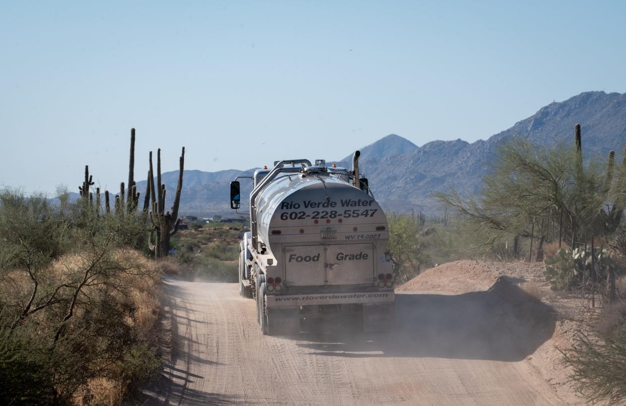 A Rio Verde Foothills Potable Water truck drives on 136th Street while making a delivery on Oct. 10, 2023, to a client in Rio Verde Foothills.