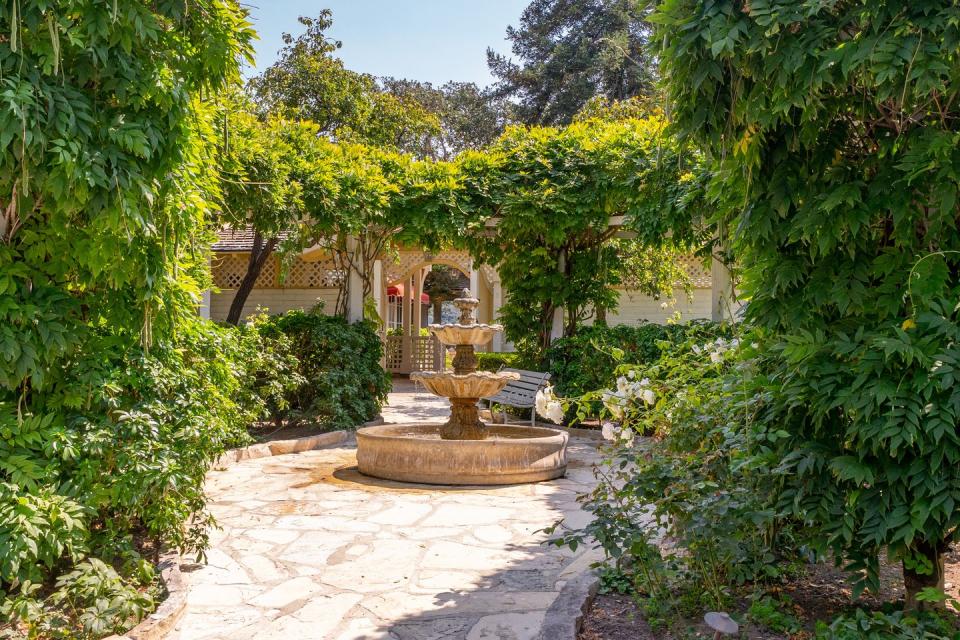 The gardens feature fountains, sitting areas, and paths for dog-walking.