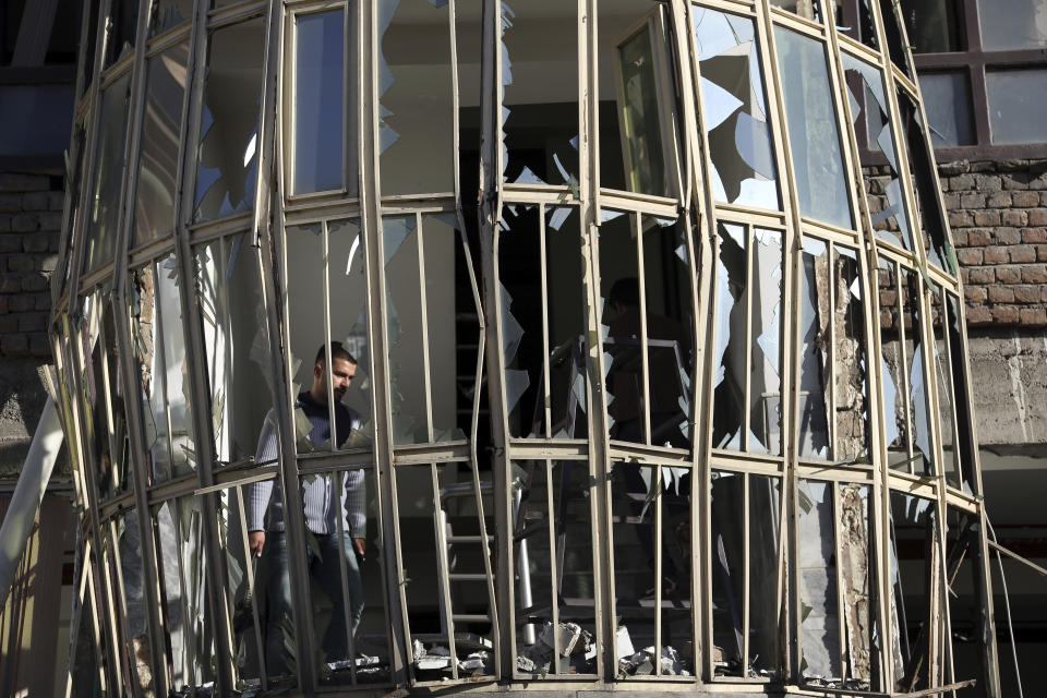 <p>An Afghan boy walks at the scene of a suicide attack on a Shiite cultural center in Kabul, Afghanistan, Thursday, Dec. 28, 2017. (Photo: Rahmat Gul/AP) </p>