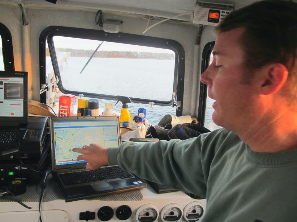 Coastal Carolina University marine researcher James Phillips shows the harbor shipping channel on a computer aboard a survey boat in the harbor in Charleston, S.C., on Friday, October 12, 2012. Researchers from the university are conducting a survey of the bottom of Charleston Harbor as part of a planned $300 million harbor deepening project. (AP Photo/Bruce Smith)