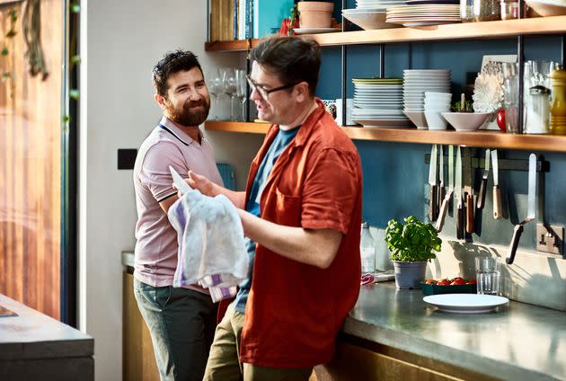 Household chores don't need to be split exactly down the middle for both partners to be satisfied with the arrangement. (Photo: 10'000 Hours via Getty Images)