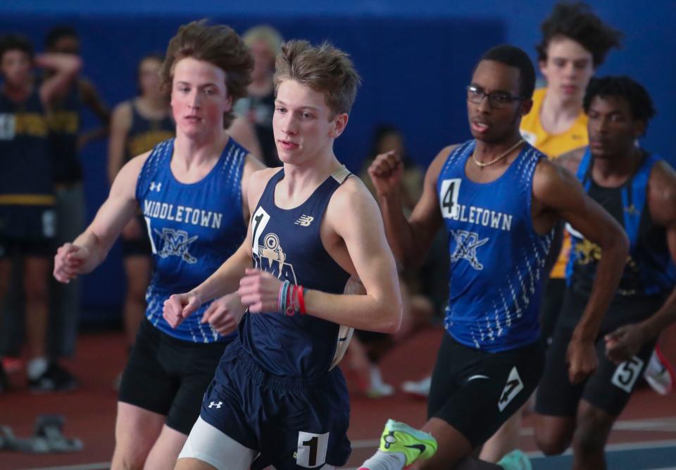 Delaware Military's Ethan Walther (front)  holds a lead early before winning the 1600 meter race during the DIAA state high school indoor track and field championships at Prince George's Sports and Learning Complex in Landover, Md., Saturday, Feb. 4, 2023. Middletown's Jonas Rush (left) and Jonathan Drew (4) pursue.