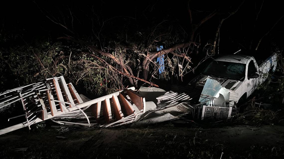 Just before the Sanibel Causeway, a spiral staircase was deposited in the brush next to a white pickup as Hurricane Ian passed the area Thursday, Sept. 29, 2022 in Sanibel, Fla. Hurricane Ian has left a path of destruction in Southwest Florida, trapping people in flooded homes, damaging the roof of a hospital intensive care unit and knocking out power to 2.5 million people.