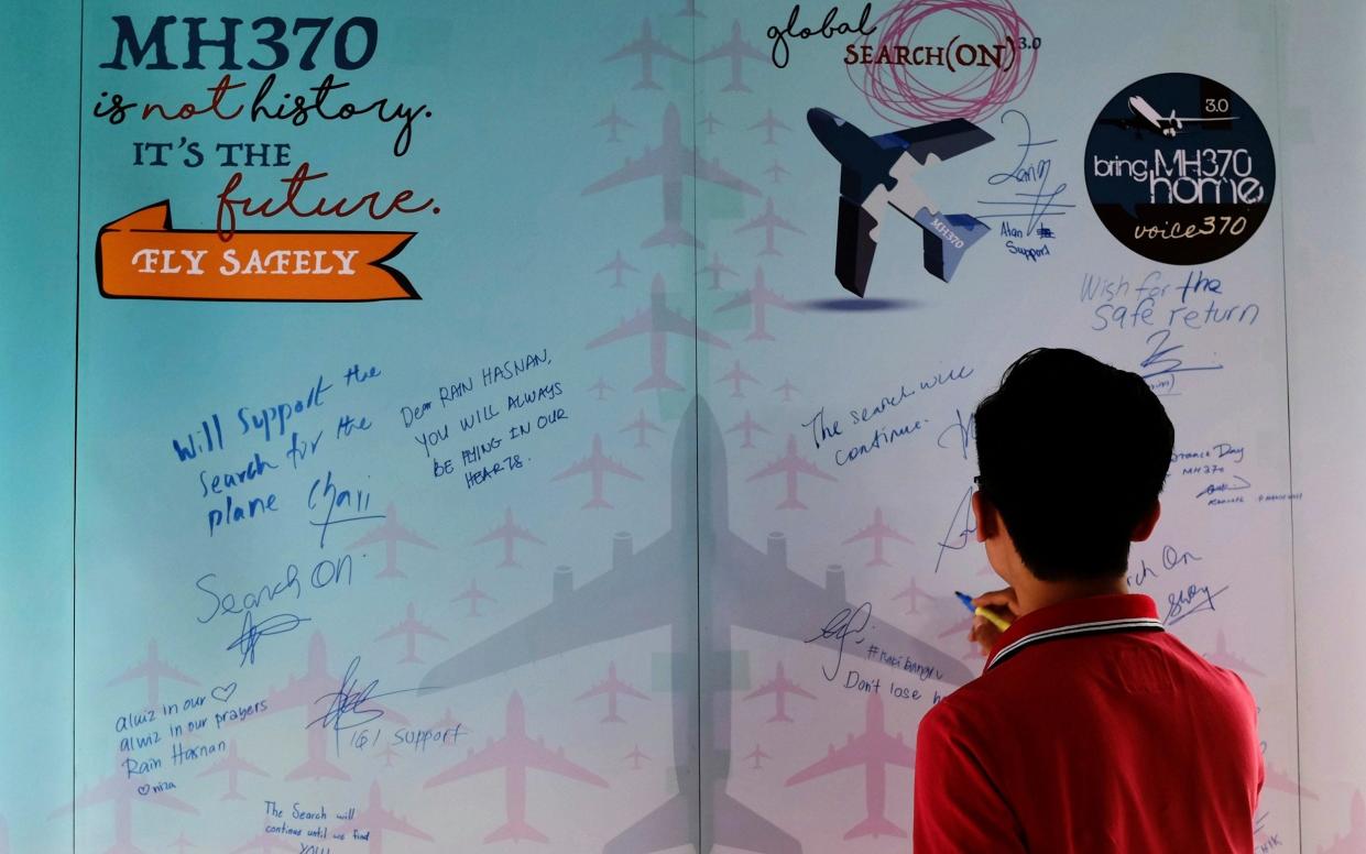 A wall of condolence to the 239 people who were on flight MH370 from Kuala Lumpur - Daniel Chan/AP