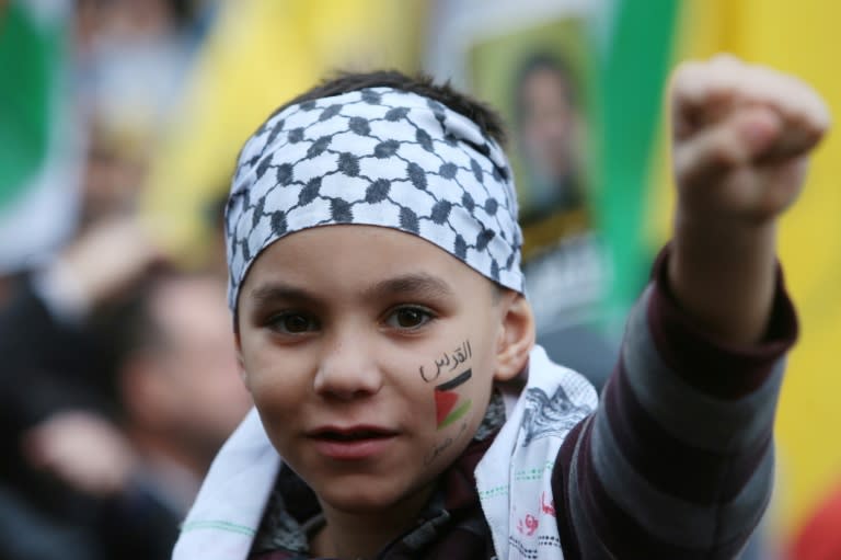 A boy with a Palestinian flag painted on his face during a rally organised by Lebanon's Hezbollah in Beirut on December 11, 2017