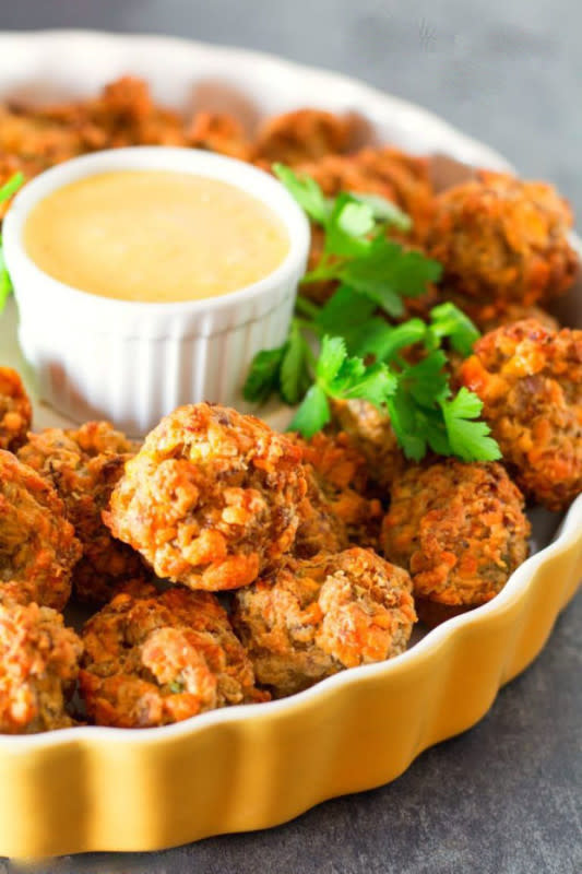 <p>Melissa's Southern Style Kitchen</p><p>Made with biscuit mix, country sausage and lots of cheese, these mini meatballs are the perfect fall appetizer.</p><p><strong>Get the recipe: </strong><a href="https://www.melissassouthernstylekitchen.com/cheddar-sausage-balls/" rel="nofollow noopener" target="_blank" data-ylk="slk:Cheddar Sausage Balls;elm:context_link;itc:0;sec:content-canvas" class="link rapid-noclick-resp"><strong>Cheddar Sausage Balls</strong></a></p><p><strong>Related: <a href="https://parade.com/847668/cathypollak/24-appetizers-on-toothpicks/" rel="nofollow noopener" target="_blank" data-ylk="slk:35 Toothpick Appetizers To Curb the Munchies;elm:context_link;itc:0;sec:content-canvas" class="link rapid-noclick-resp">35 Toothpick Appetizers To Curb the Munchies</a></strong></p>