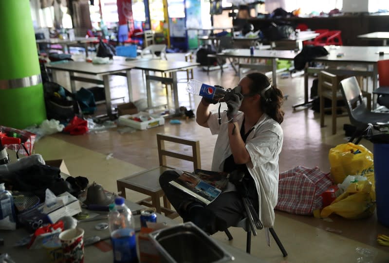 A protester who calls himself "Riot Chef", and who said he was a volunteer cook for protesters, sits in a canteen in Hong Kong Polytechnic University (PolyU)