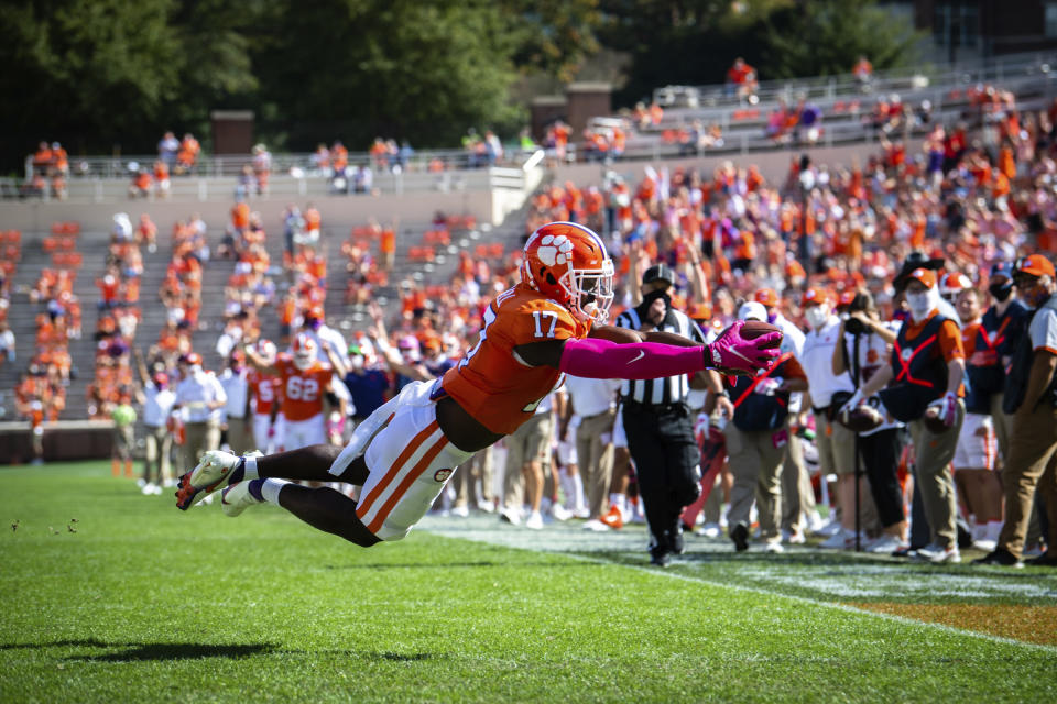 Clemson wide receiver Cornell Powell (17) dives into the end zone for a touchdown during an NCAA college football game against Syracuse in Clemson, S.C., on Saturday, Oct. 24, 2020. (Ken Ruinard/Pool Photo via AP)