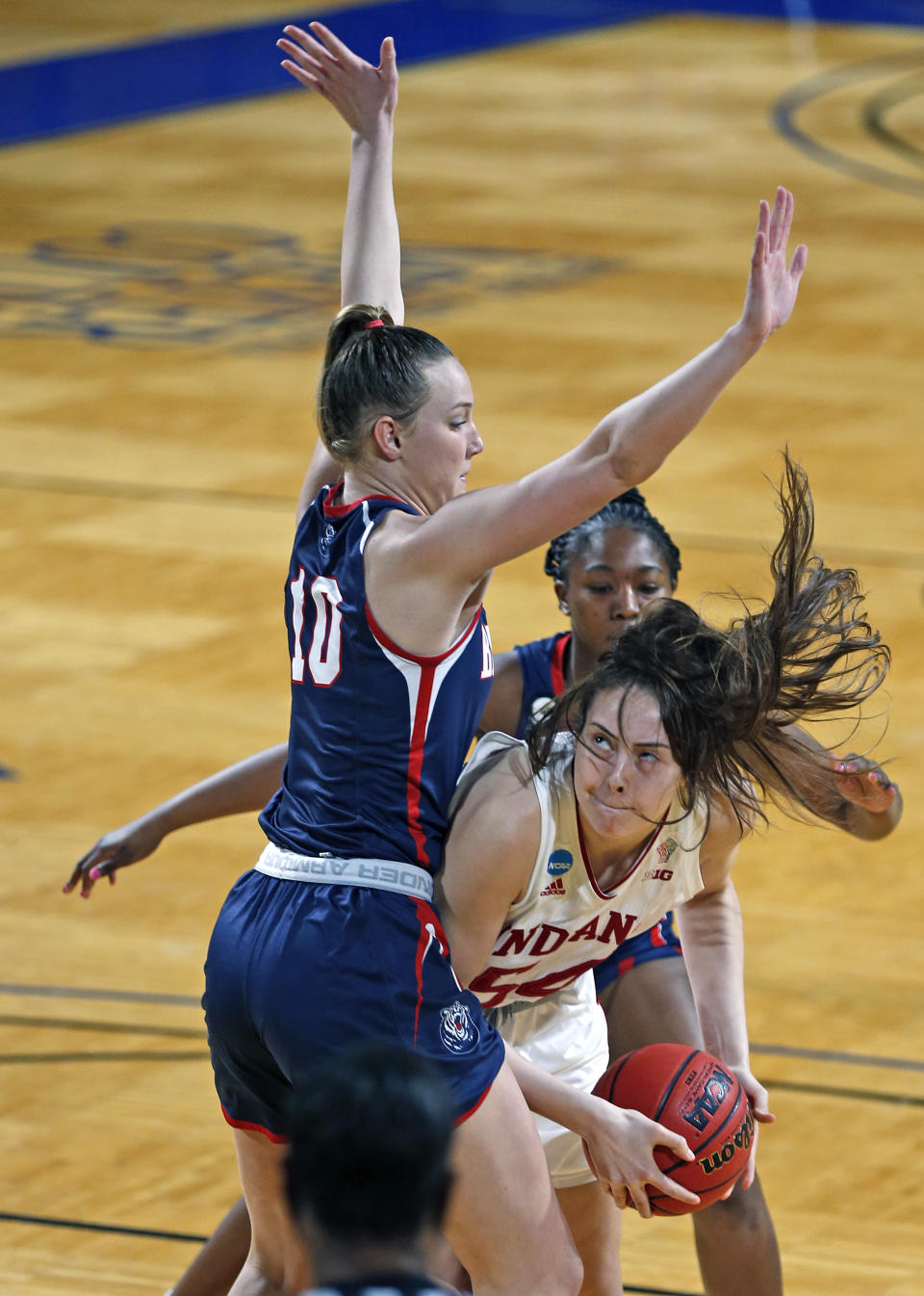 Indiana forward MacKenzie Holmes (54) drives on Belmont forward Allison Luly (10) during the first half of a college basketball game in the second round of the NCAA women's tournament at Greehey Arena in San Antonio on Wednesday, March 24, 2021. (AP Photo/Ronald Cortes)
