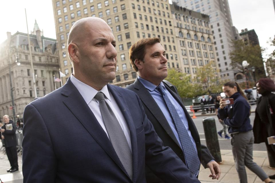 Image shows campaign finance conspiracy suspect David Correia (left) leaving an arraignment hearing in Manhattan federal court in New York City with defense lawyer Jeffrey Marcus on October 17, 2019.