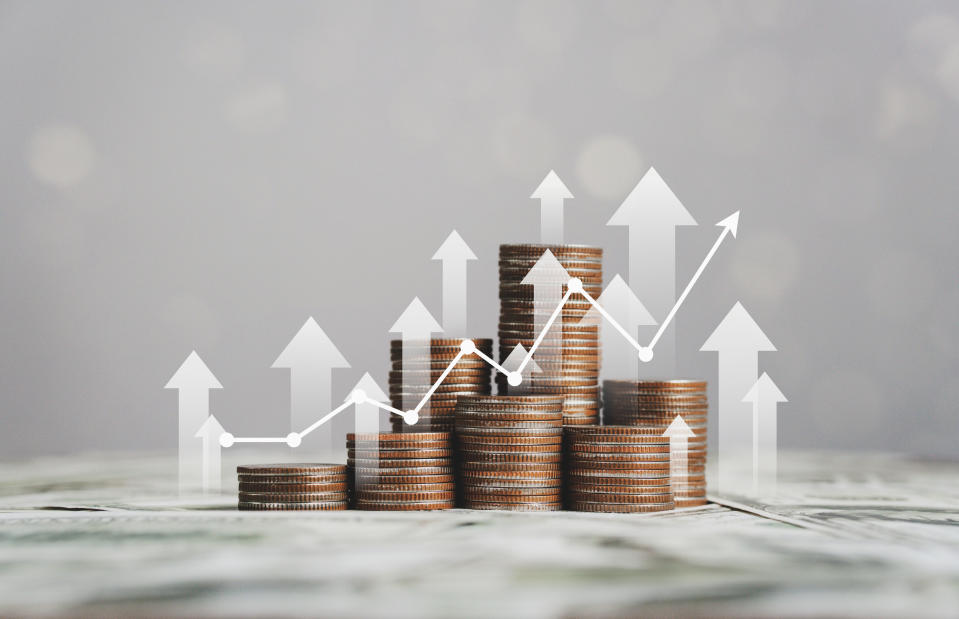 stack of silver coins with trading chart in financial concepts and financial investment business stock growth