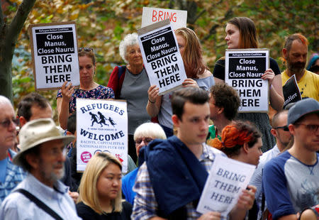 Protesters from the Refugee Action Coalition hold placards during a demonstration outside the offices of the Australian Government Department of Immigration and Border Protection in Sydney, Australia, April 29, 2016. REUTERS/David Gray