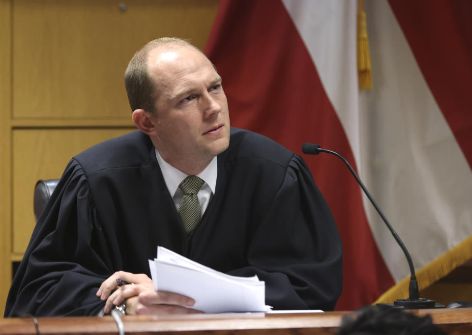 Fulton County Superior Judge Scott McAfee presides during a hearing on the Georgia election interference case, Friday, Feb. 16, 2024, in Atlanta. The hearing is to determine whether Fulton County District Attorney Fani Willis should be removed from the case because of a relationship with Wade, special prosecutor, she hired in the election interference case against former President Donald Trump. (Alyssa Pointer/Pool Photo via AP)