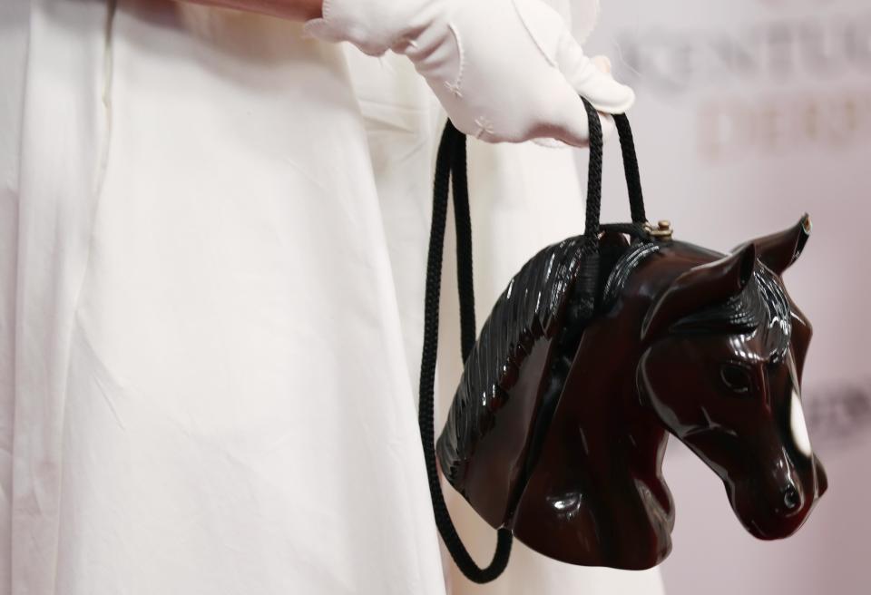 <p>DeeDee Sorvino arrives on the red carpet with a horse shaped purse during the 144th running of the Kentucky Derby at Churchill Downs in Louisville, Ky., May 5, 2018. (Photo: Mark Zerof/USA TODAY Sports/Reuters) </p>