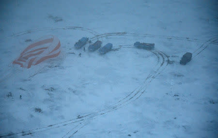 Search and rescue teams work at the site of landing of the Soyuz MS-06 space capsule with International Space Station crew members Joe Acaba and Mark Vande Hei of the U.S., and Alexander Misurkin of Russia in a remote area outside the town of Dzhezkazgan (Zhezkazgan), Kazakhstan, on February 28, 2018. REUTERS/Alexander Nemenov/Pool