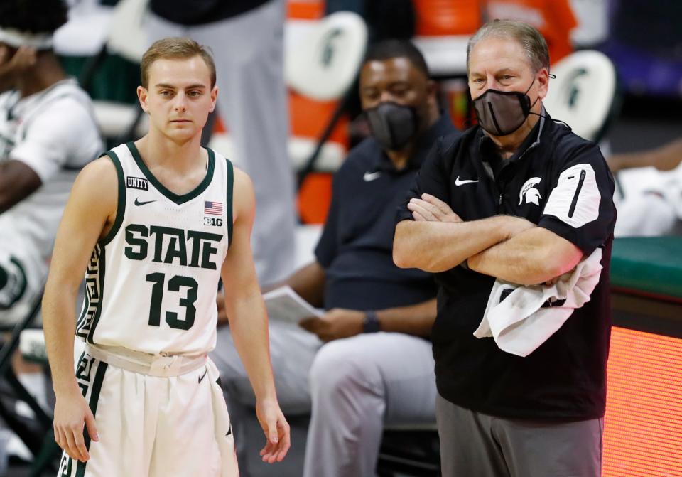 Dec 6, 2020; East Lansing, Michigan, USA; Michigan State Spartans head coach Tom Izzo stands next to son and player guard Steven Izzo (13) during the second half at against the Western Michigan Broncos Jack Breslin Student Events Center. Mandatory Credit: Raj Mehta-USA TODAY Sports