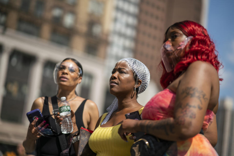 People attend a rally with Terrence Floyd, brother of George Floyd, on Sunday, May 23, 2021, in Brooklyn borough of New York. George Floyd, whose May 25, 2020 death in Minneapolis was captured on video, plead for air as he was pinned under the knee of former officer Derek Chauvin, who was convicted of murder and manslaughter in April 2021. (AP Photo/Eduardo Munoz Alvarez)