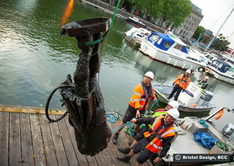 Workers remove the statue of Edward Colston from the Bristol Harbour, in Bristol