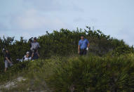 Bryson DeChambeau, of the United States, watches his second shot from the rough at the 16th hole during the second round of the Hero World Challenge PGA Tour at the Albany Golf Club, in New Providence, Bahamas, Friday, Dec. 3, 2021.(AP Photo/Fernando Llano)